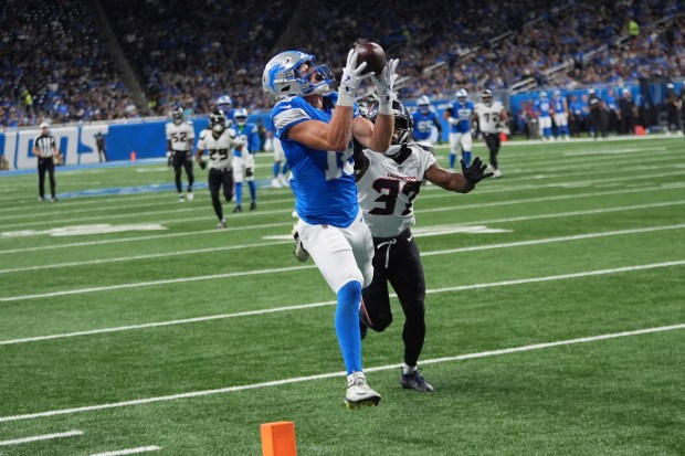 Detroit Lions wide receiver Isaac TeSlaa (18) catches a pass...