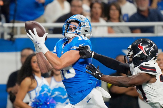 Detroit Lions wide receiver Isaac TeSlaa (18) catches a pass...