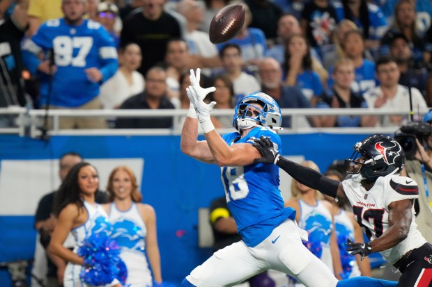 Detroit Lions wide receiver Isaac TeSlaa (18) catches a pass...