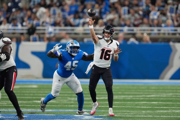 Houston Texans quarterback Kedon Slovis (16) throws pass as Detroit...
