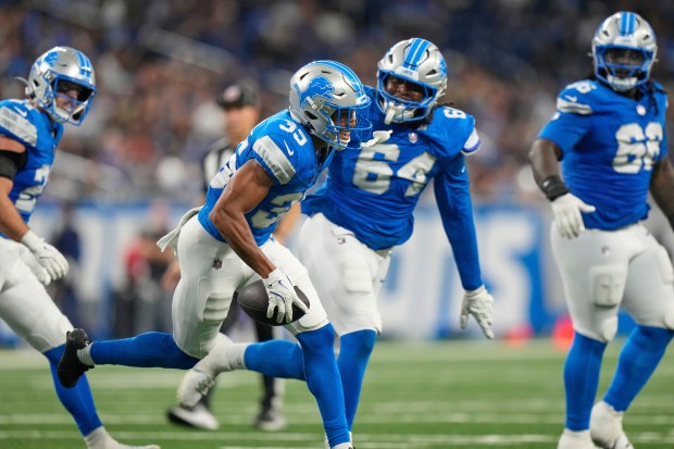 Detroit Lions' Tyson Russell (35) celebrates after intercepting a pass...