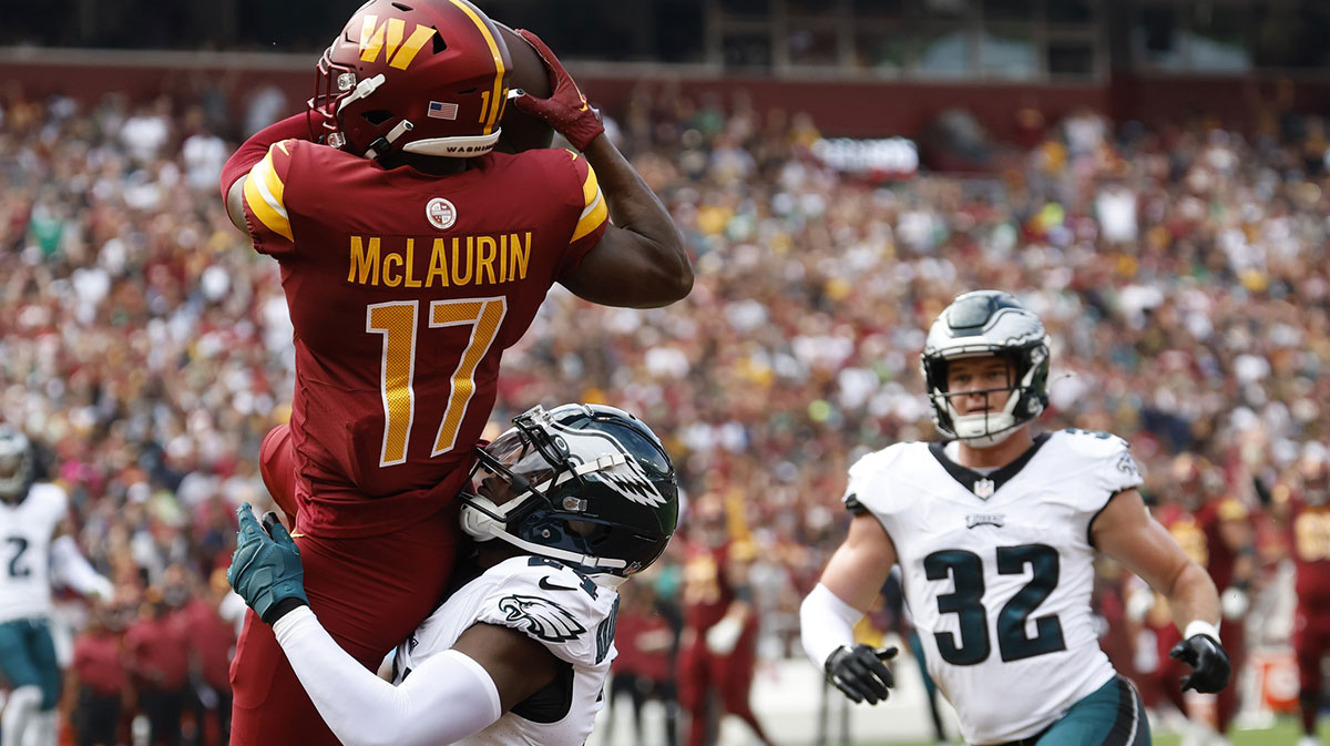 Oct 29, 2023; Landover, Maryland, USA; Washington Commanders wide receiver Terry McLaurin (17) catches a touchdown pass as Philadelphia Eagles cornerback James Bradberry (24) defends during the first quarter at FedExField. 