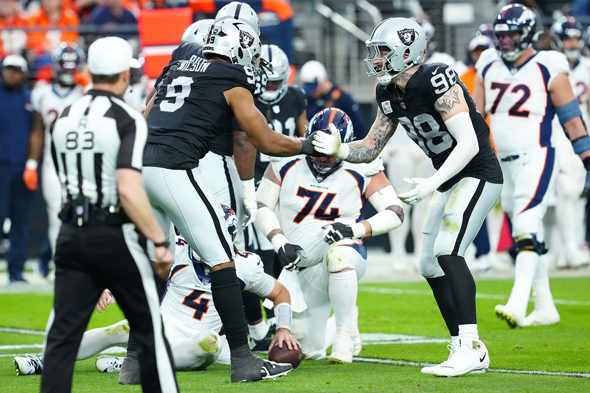 Las Vegas Raiders defensive end Tyree Wilson (9) celebrates with Las Vegas Raiders defensive end Maxx Crosby (98) after sacking Denver Broncos quarterback Jarrett Stidham (4) during the second quarter at Allegiant Stadium.