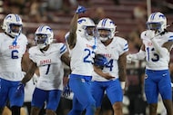 SMU safety Isaiah Nwokobia (23) celebrates with teammates after intercepting a pass against...