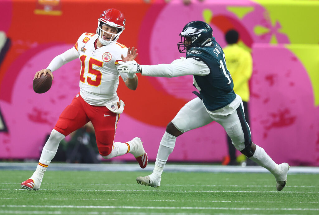 Kansas City Chiefs Patrick Mahomes (15) is tackled by Philadelphia Eagles linebacker Josh Sweat (19) in Super Bowl LIX between the Philadelphia Eagles and the Kansas City Chiefs.