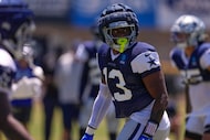 Dallas Cowboys defensive end Dante Fowler Jr. gets set to run a play during training camp...
