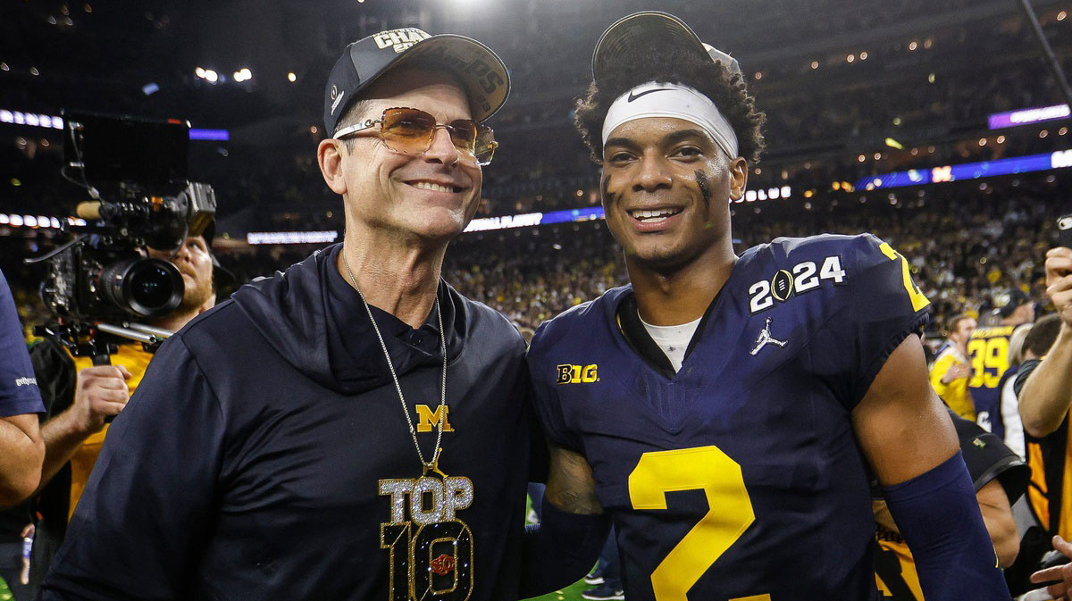 Michigan head coach Jim Harbaugh and defensive back Will Johnson (2) celebrate after their 34-13 win over Washington to win the national championship at NRG Stadium in Houston on Monday, Jan. 8, 2024.