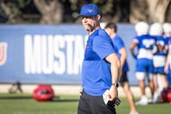 SMU Head Coach Rhett Lashlee pulls a play sheet out of his pocket during fall football camp...