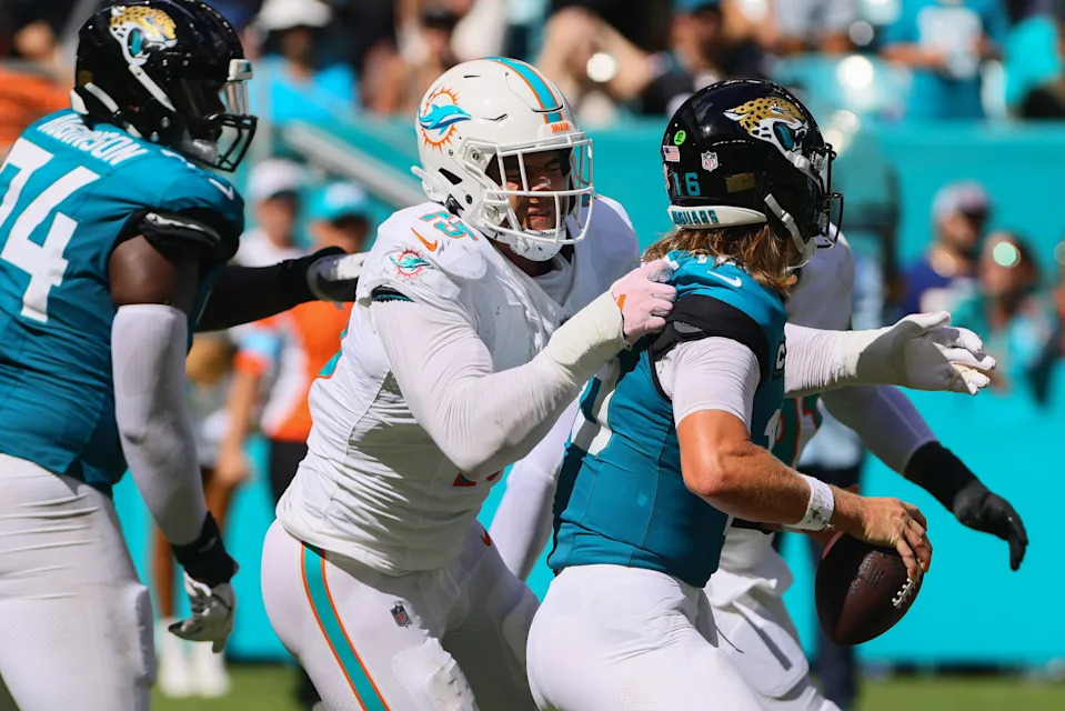 Sep 8, 2024; Miami Gardens, Florida, USA; Miami Dolphins linebacker Jaelan Phillips (15) sacks Jacksonville Jaguars quarterback Trevor Lawrence (16) during the fourth quarter at Hard Rock Stadium. Mandatory Credit: Sam Navarro-Imagn Images