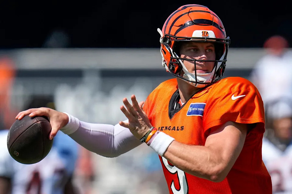 Cincinnati Bengals quarterback Joe Burrow throws a pass during a preseason training camp practice in downtown Cincinnati on Wednesday, July 30, 2025.