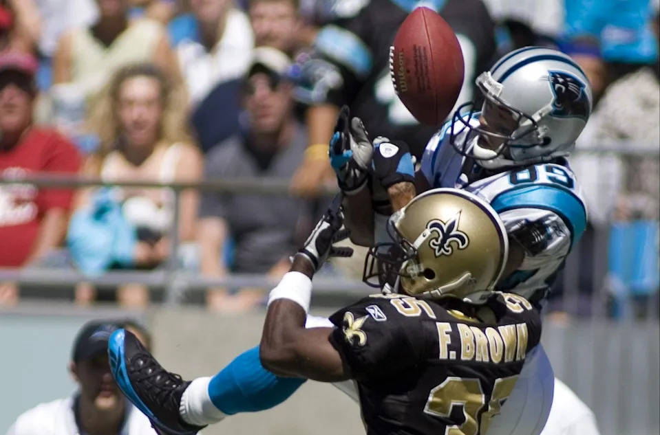 September 11, 2005; Charlotte, NC, USA; New Orleans Saints #35 Fakhir Brown breaks up a pass to Carolina Panthers #89 Steve Smith in first half action in the Saints 23-20 win over the Carolina Panthers at Bank of America Stadium. Mandatory Credit: Bob Donnan-USA TODAY Sports Copyright © 2005 Bob Donnan