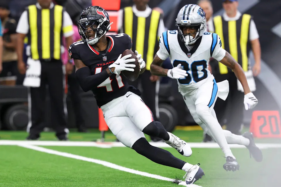 Aug 16, 2025; Houston, Texas, USA; Houston Texans cornerback Damon Arnette (41) runs with the ball after making an interception during the fourth quarter against the Carolina Panthers at NRG Stadium. Mandatory Credit: Troy Taormina-Imagn Images