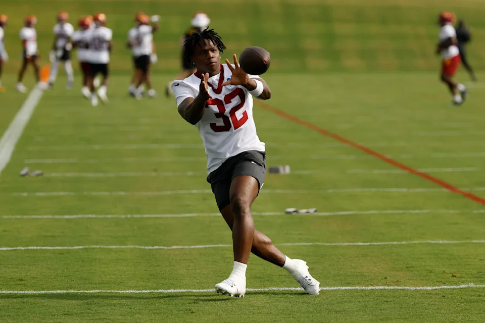 Jul 23, 2025; Ashburn, VA, USA; Washington Commanders running back Jacory Croskey-Merritt (32) catches a ball during practice on day one of training camp at OrthoVirginia Training Center at Commanders Park. Mandatory Credit: Geoff Burke-Imagn Images