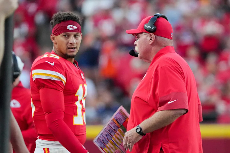 Aug 22, 2025; Kansas City, Missouri, USA; Kansas City Chiefs quarterback Patrick Mahomes (15) talks with head coach Andy Reid after a play against the Chicago Bears during the first half of the game at GEHA Field at Arrowhead Stadium. Mandatory Credit: Denny Medley-Imagn Images