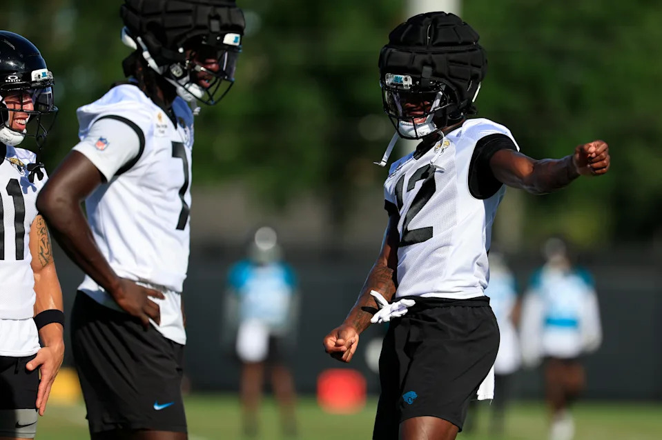From right, Jacksonville Jaguars wide receiver Travis Hunter (12) dances near wide receiver Brian Thomas Jr. (7) as wide receiver Parker Washington (11) reacts during an NFL training camp session at the Miller Electric Center, Monday, Aug. 11, 2025 in Jacksonville, Fla. [Corey Perrine/Florida Times-Union]