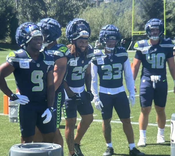Kenneth Walker (9), Zach Charbonnet (second from left), Damien Martinez, D.K. Kaufman and Robbie Ouzts in running-back drills during the fifth practice of Seattle Seahawks NFL training camp at the Virginia Mason Athletic Center Monday, July 28, 2025.
