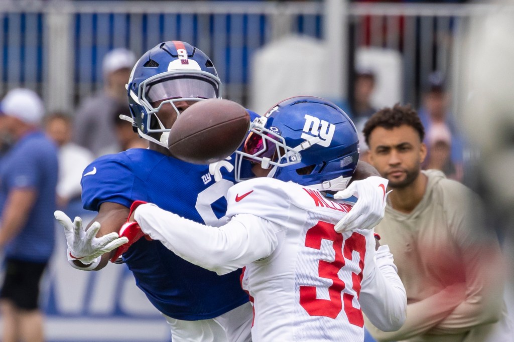 Giants cornerback Dee Williams (33) breaks up a pass to wide receiver Da'Quan Felton (9) during training camp at the Quest Diagnostics center, Friday, Aug. 1, 2025, in East Rutherford, New Jersey.