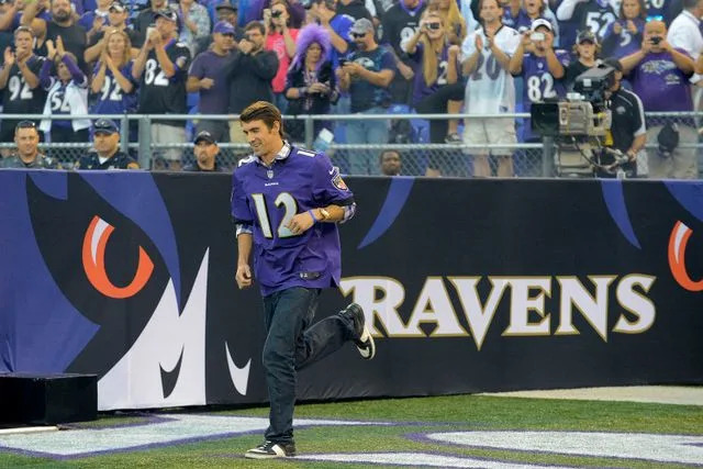 Doug Kapustin/Tribune News Service/Getty Michael Phelps leads the Ravens offense on Sept. 10, 2012