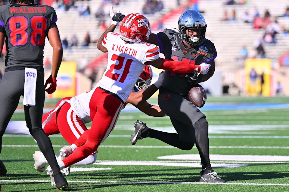 ALBUQUERQUE, NEW MEXICO - DECEMBER 28: Cornerback Keyon Martin #21 of the Louisiana Ragin' Cajuns forces a fumble against running back Trent Battle #17 of the TCU Horned Frogs during the first half of the Isleta New Mexico Bowl at University Stadium on December 28, 2024 in Albuquerque, New Mexico. (Photo by Sam Wasson/Getty Images)