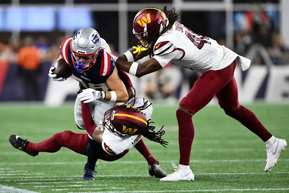 Aug 8, 2025; Foxborough, Massachusetts, USA; Washington Commanders safety Tyler Owens (40) tackles New England Patriots wide receiver Efton Chism III (86) during the second half at Gillette Stadium. Mandatory Credit: Brian Fluharty-Imagn Images© Brian Fluharty-Imagn Images