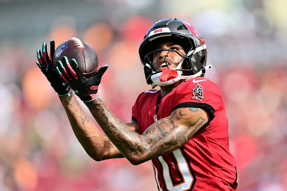 TAMPA, FLORIDA - DECEMBER 29: Trey Palmer #10 of the Tampa Bay Buccaneers catches a pass during warmups before the game against the Carolina Panthers at Raymond James Stadium on December 29, 2024 in Tampa, Florida. (Photo by Julio Aguilar/Getty Images)
