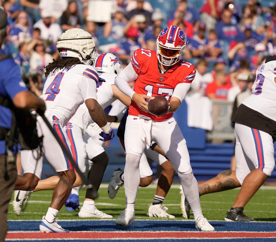 Buffalo Bills quarterback Josh Allen hands the ball off to running back James Cook during the Return of the Blue & Red practice at Highmark Stadium in Orchard Park on Aug.1, 2025.