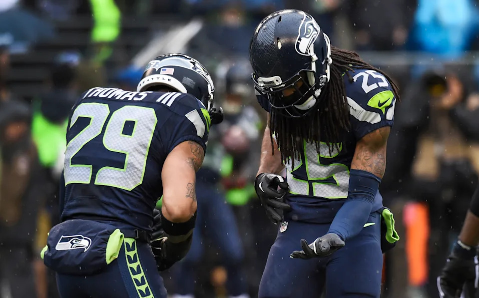 Richard Sherman (25), Earl Thomas and the Seahawks' Legion of Boom defense looked at the passing proliferation across the NFL and punched it in the mouth around the turn of the last decade. (Photo by Steve Dykes/Getty Images)