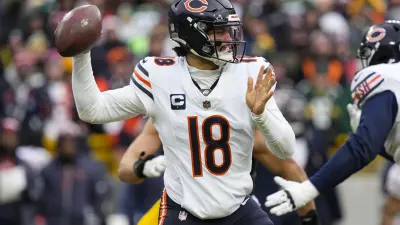 Jan 5, 2025; Green Bay, Wisconsin, USA; Chicago Bears quarterback Caleb Williams (18) throws a pass during the fourth quarter against the Green Bay Packers at Lambeau Field.