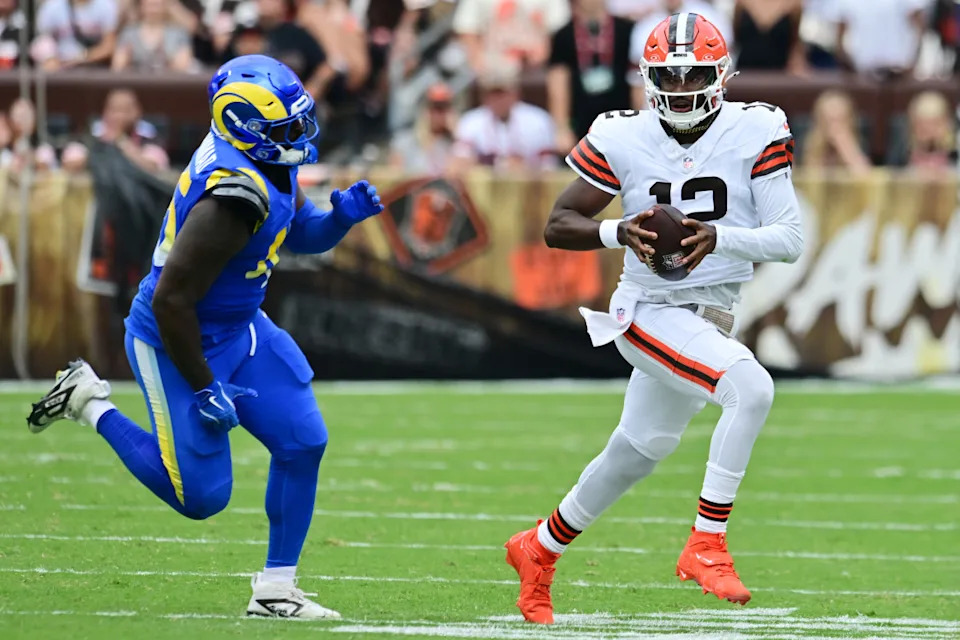 Aug 23, 2025; Cleveland, Ohio, USA; Los Angeles Rams linebacker Jamil Muhammad (45) chases Cleveland Browns quarterback Shedeur Sanders (12) during the second half at Huntington Bank Field. Mandatory Credit: Ken Blaze-Imagn Images