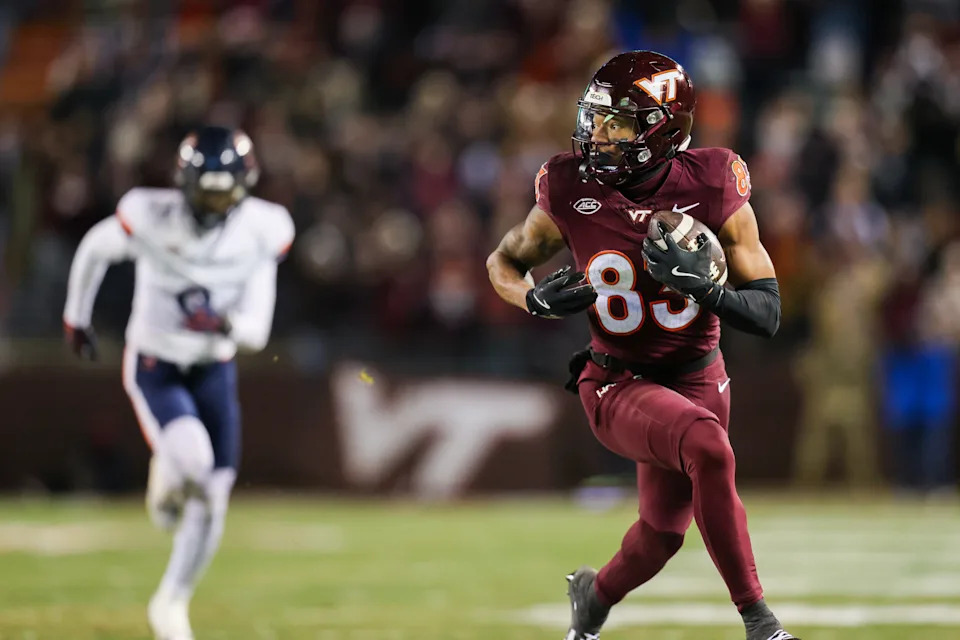 BLACKSBURG, VIRGINIA - NOVEMBER 30: Jaylin Lane #83 of the Virginia Tech Hokies runs the ball for a touchdown against the Virginia Cavaliers in the first half during a game at Lane Stadium on November 30, 2024 in Blacksburg, Virginia. (Photo by Ryan Hunt/Getty Images)