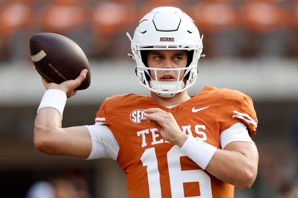 Arch Manning #16 of the Texas Longhorns warming up before a football game.