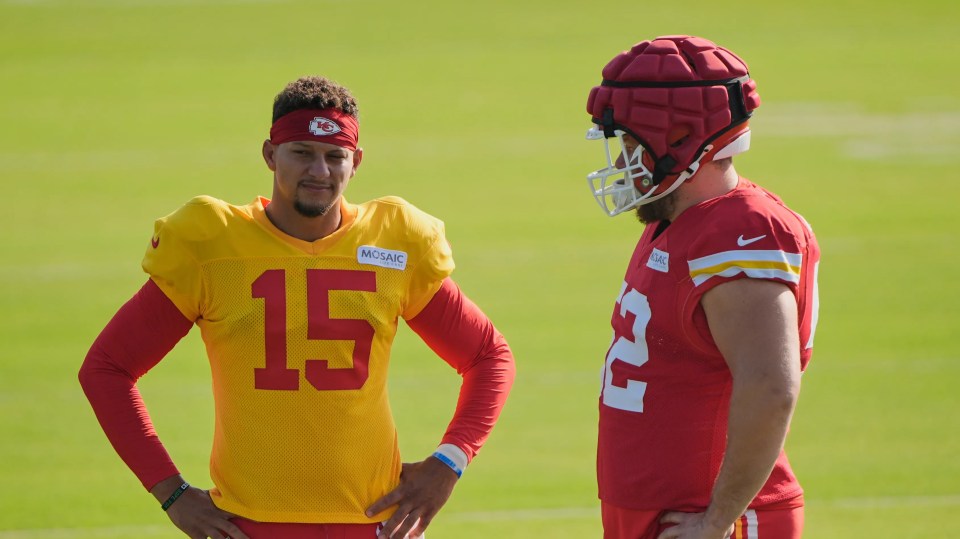 Patrick Mahomes and Creed Humphrey of the Kansas City Chiefs talking on the field.