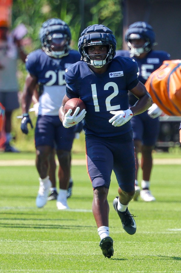 Bears wide receiver Devin Duvernay runs with the ball during an interception drill at a joint practice with the Dolphins at Halas Hall on Aug. 8, 2025, in Lake Forest. (Stacey Wescott/Chicago Tribune)