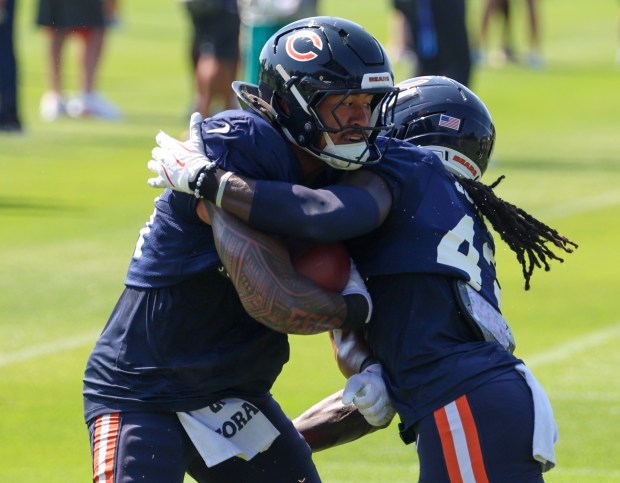 Bears linebackers Noah Sewell, left, and Carl Jones face off during a joint practice with the Dolphins at Halas Hall on Aug. 8, 2025, in Lake Forest. (Stacey Wescott/Chicago Tribune)