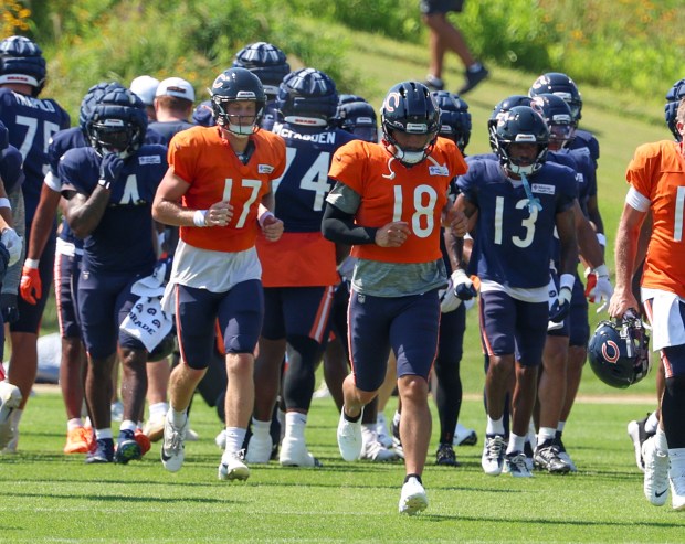 Bears quarterbacks Tyson Bagent (17) and Caleb Williams (18) run downfield during a joint practice with the Dolphins at Halas Hall on Aug. 8, 2025, in Lake Forest. (Stacey Wescott/Chicago Tribune)
