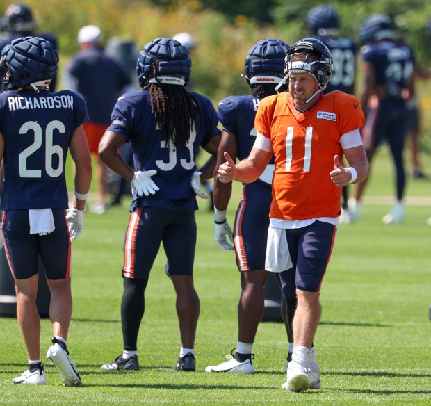 Bears quarterback Case Keenum (11) gives two thumbs-up during a joint practice with the Dolphins at Halas Hall on Aug. 8, 2025, in Lake Forest. (Stacey Wescott/Chicago Tribune)