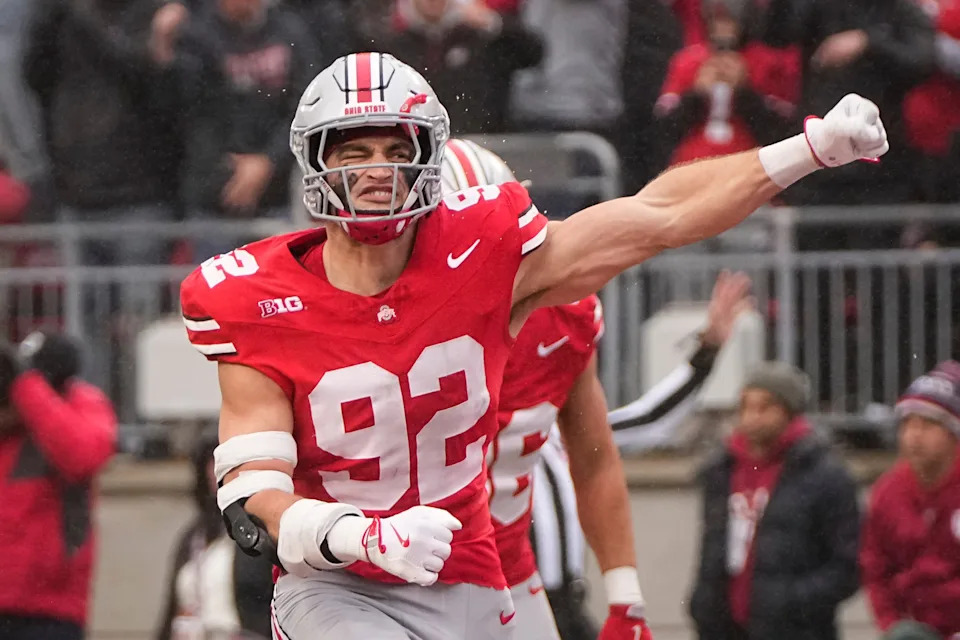 Ohio State Buckeyes defensive end Caden Curry (92) celebrates a botched punt by Indiana Hoosiers punter James Evans during the NCAA football game at Ohio Stadium in Columbus on Monday, Nov. 25, 2024. Ohio State won 38-15.
