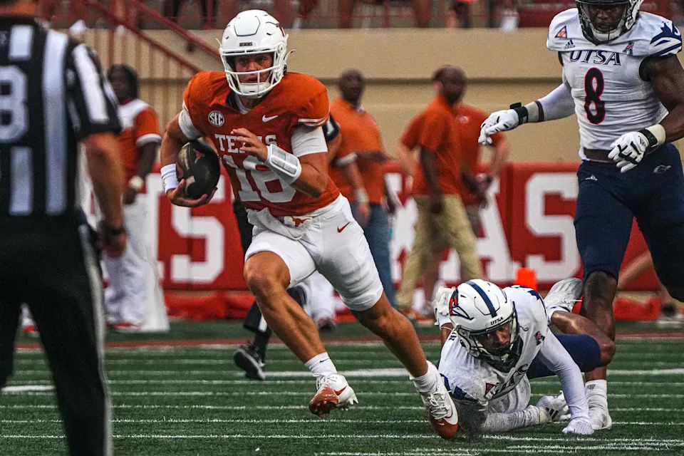 Texas quarterback Arch Manning gains yardage during a game in Austin last September.