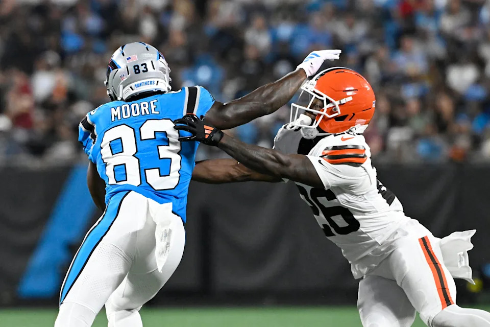 Aug 8, 2025; Charlotte, North Carolina, USA; Carolina Panthers wide receiver Kobe Hudson (86) with the ball as Cleveland Browns cornerback Myles Harden (26) defends in the third quarter at Bank of America Stadium. Mandatory Credit: Bob Donnan-Imagn Images