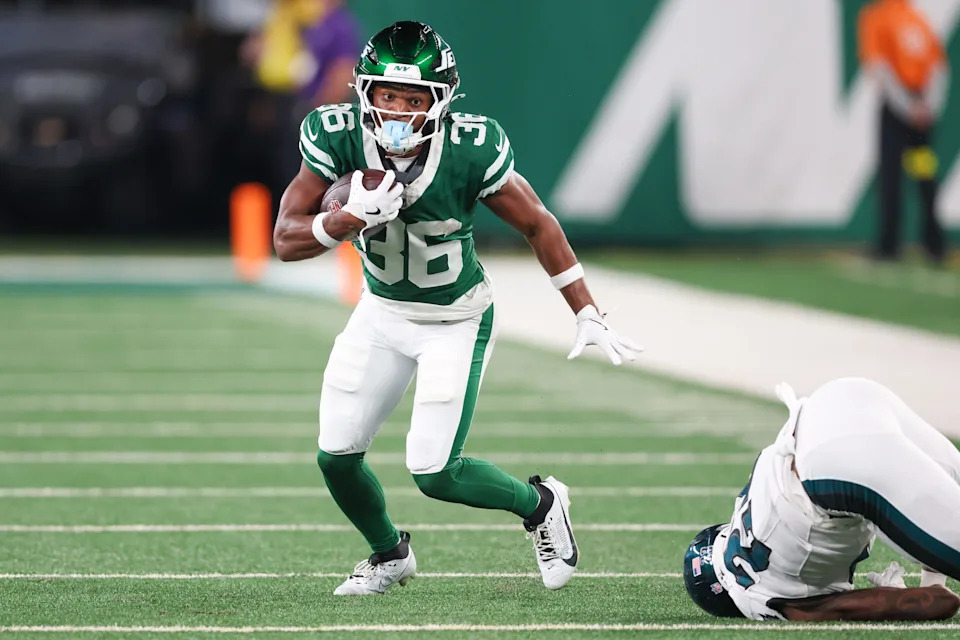 Aug 22, 2025; East Rutherford, New Jersey, USA; New York Jets wide receiver Jamaal Pritchett (36) gains yards after catch in front of Philadelphia Eagles cornerback Eli Ricks (23) during the second half at MetLife Stadium. Mandatory Credit: Vincent Carchietta-Imagn Images