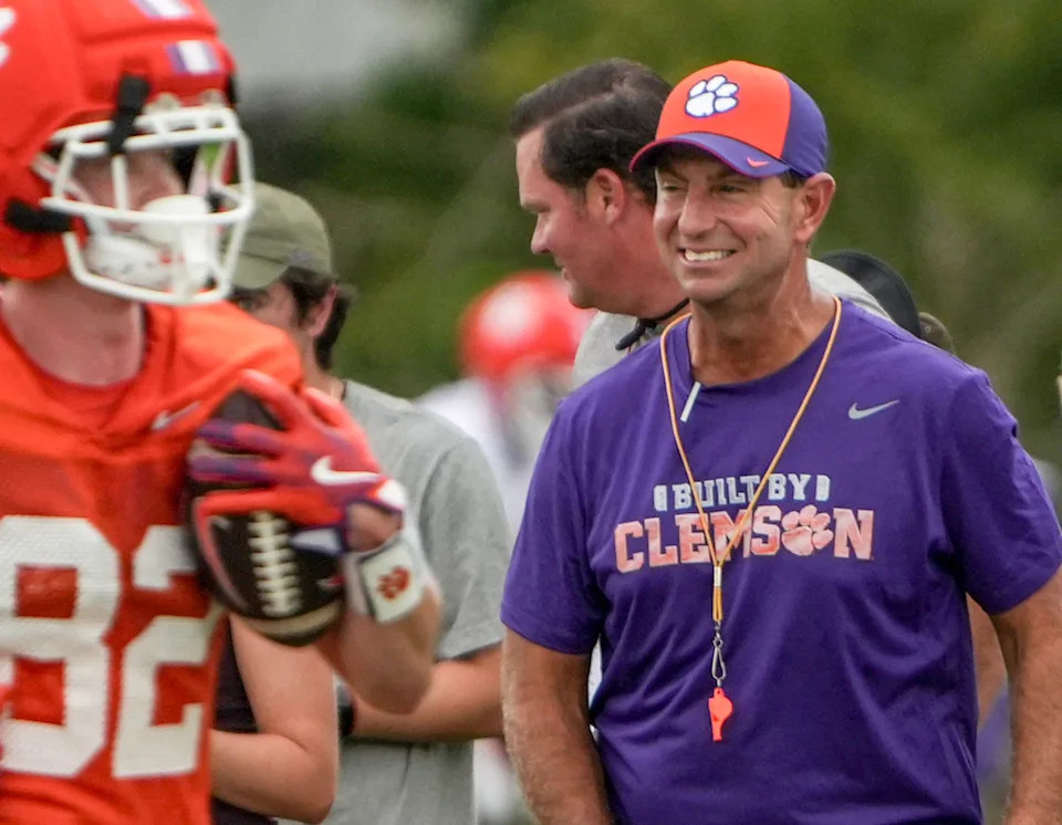 Clemson head coach Dabo Swinney smiles watching wide receiver drills during Clemson football 2025 practice at the Allen N. Reeves Football Complex in Clemson, S.C. Friday, August 1, 2025.