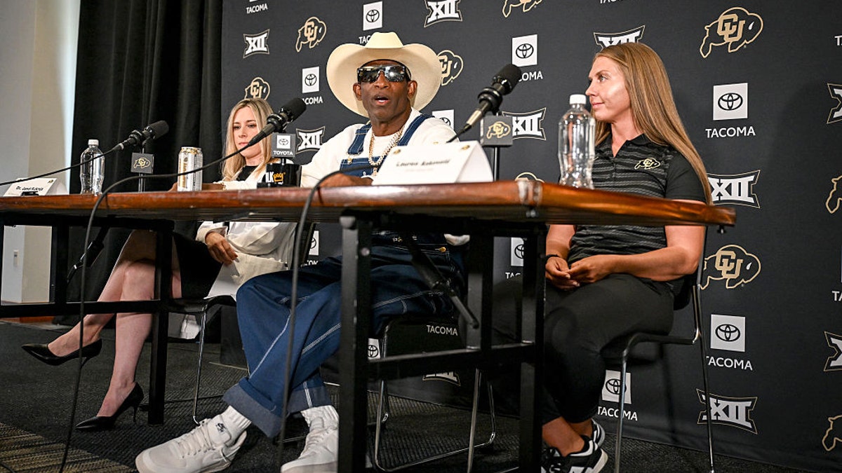 Deion Sanders with doctors