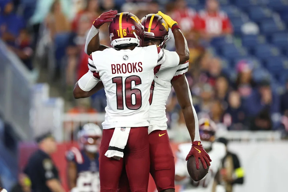 Aug 8, 2025; Foxborough, Massachusetts, USA; Washington Commanders receiver Jacoby Jones (10) and Washington Commanders receiver Ja'Corey Brooks (16) celebrate after a touchdown during the second half at Gillette Stadium. Mandatory Credit: Paul Rutherford-Imagn Images© Paul Rutherford-Imagn Images