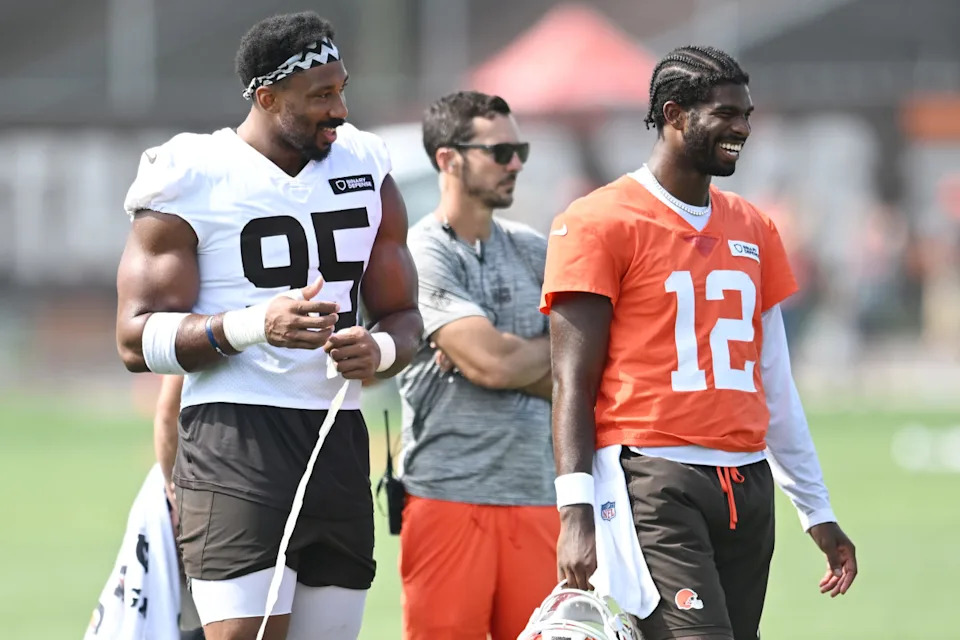 Jul 26, 2025; Berea, OH, USA; Cleveland Browns defensive end Myles Garrett (95) talks to quarterback Shedeur Sanders (12) during training camp at CrossCountry Mortgage Campus. Mandatory Credit: Ken Blaze-Imagn Images© Ken Blaze-Imagn Images