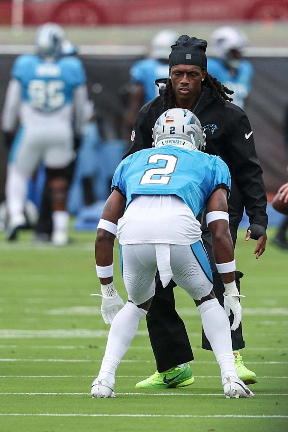 Panthers cornerback Jaycee Horn, back, runs through a drill with teammate Mike Jackson during joint practice with the Browns at training camp in Charlotte, NC on Wednesday, August 6, 2025.