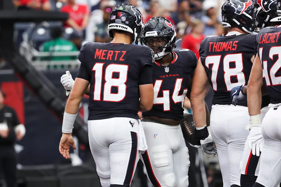 Aug 16, 2025; Houston, Texas, USA; Houston Texans running back British Brooks (44) celebrates with quarterback Graham Mertz (18) after scoring a touchdown during the fourth quarter against the Carolina Panthers at NRG Stadium. Mandatory Credit: Troy Taormina-Imagn Images