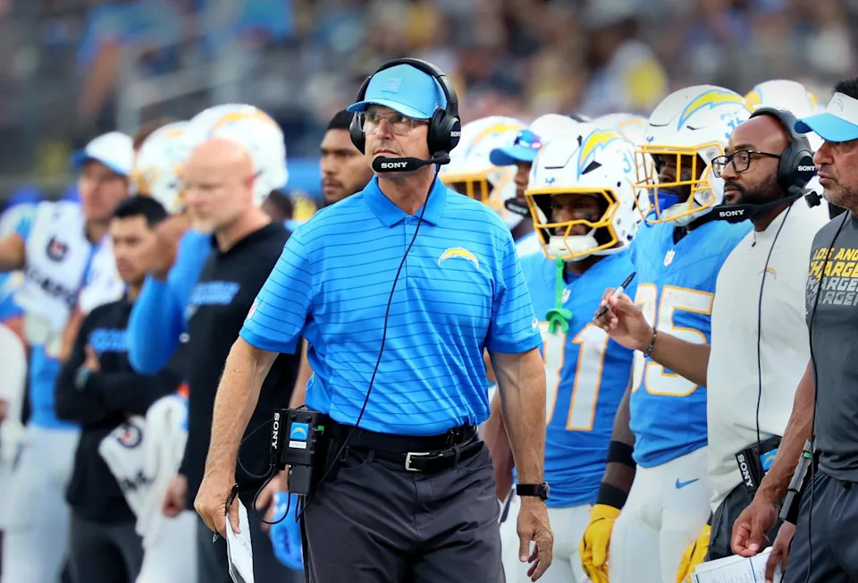 Chargers coach Jim Harbaugh watches from the sideline during a preseason loss to the Rams on Aug. 16.
