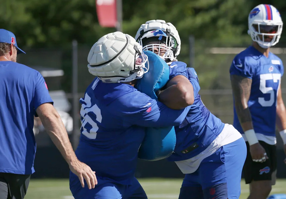 Bills rookie tackles T.J. Sanders, right, and Deone Walker lock up during drills during the opening day of Buffalo Bills training camp at St. John Fisher University Wednesday, July 23, 2025 in Pittsford.