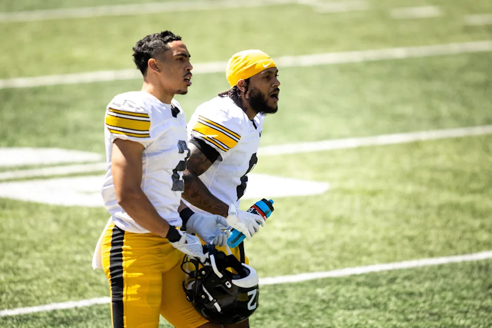 Iowa cornerbacks TJ Hall, left, and Deshaun Lee watch the action during a spring practice April 26 at Kinnick Stadium in Iowa City.