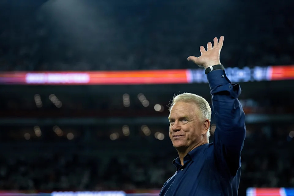 Boomer Esiason waives before being announced at halftime as a Bengals Ring of Champions inductee at halftime of the NFL game between the Cincinnati Bengals and Los Angeles Rams at Paycor Stadium in Cincinnati on Monday, Sept. 25, 2023.